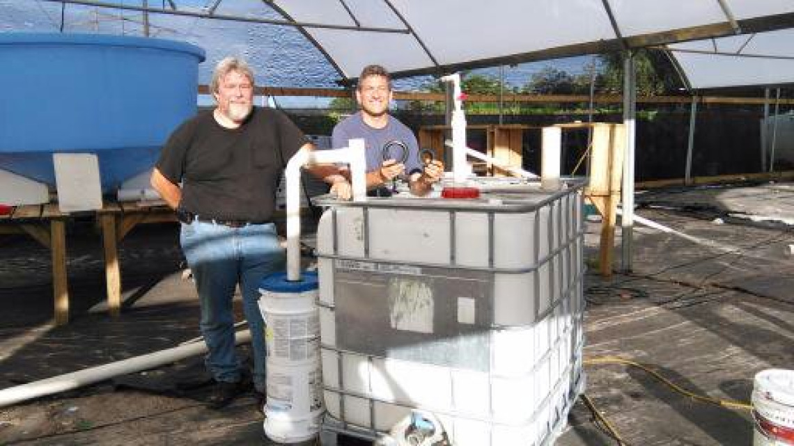 John Maer and T.H. Culhane sign their satisfaction upon completing the first Solar CITIES IBC at the Practical Education Center