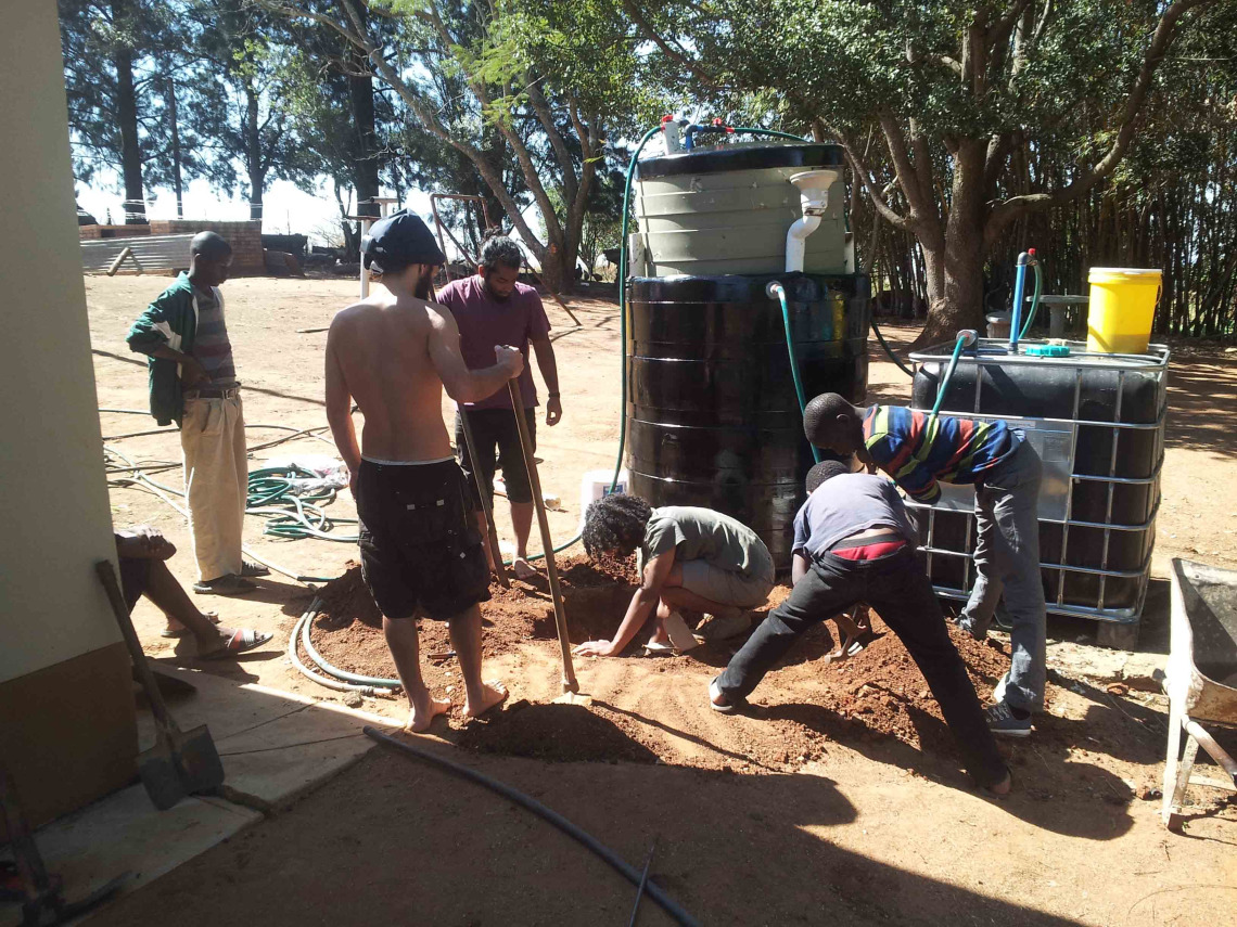 The Solar CITIES Swaziland team finishing up the biodigester for grandpa Simon's farm.