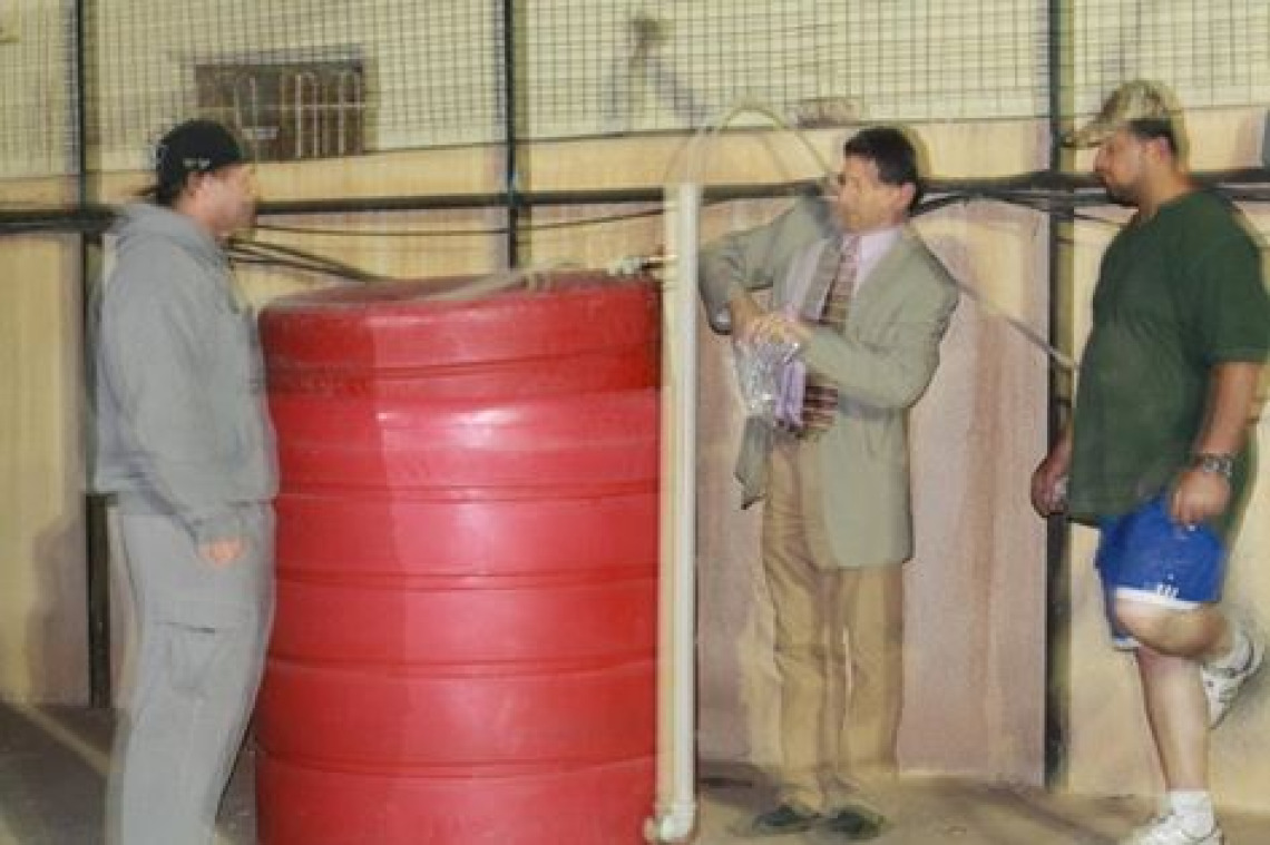 Bryant, Culhane, Maw'eid and Dave put Noel Rassam's ashes in the biodigester at the US Consulate in Kurdistan