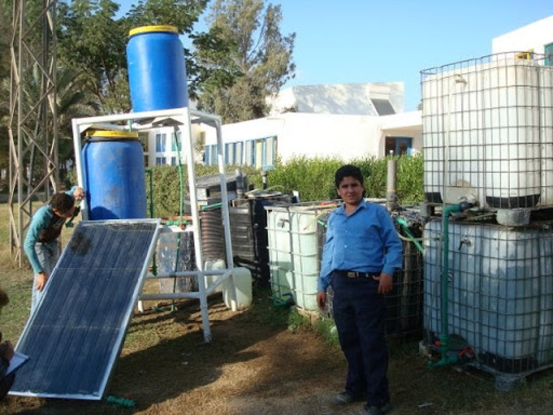Students from the Sekem science program inspect the Solar CITIES Solar heated IBC biogas system they helped build -- the first of its kind, all hand made!