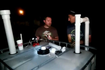 Tim and T.H. finishing construction of the backyard biodigester at night.